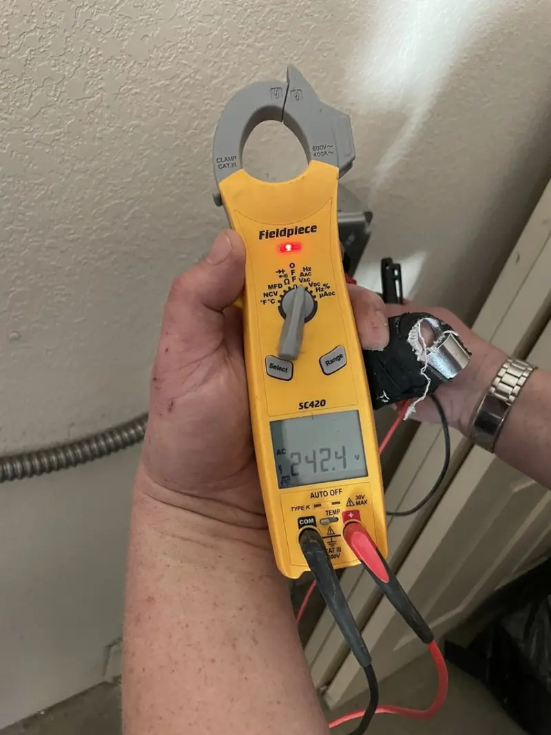 Voltage testing with clamp meter during Outlet Installation in Clewiston